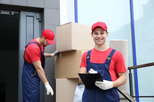 A local mover assisting with a delivery near Lower Morden homes