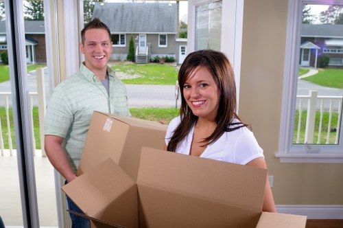 Professional movers loading household items carefully