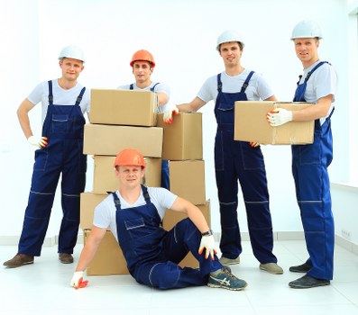 Moving team preparing a safe relocation with protective equipment