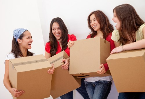 Team handling furniture removal in a Lower Morden street