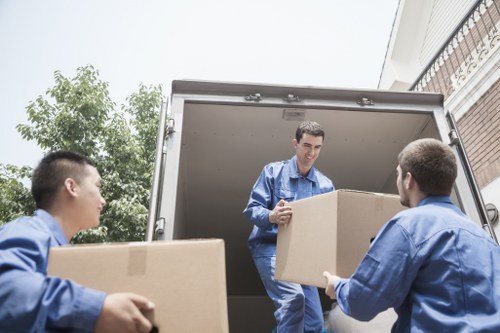 Moving team handling a home move in Lower Morden street with residential parking challenges