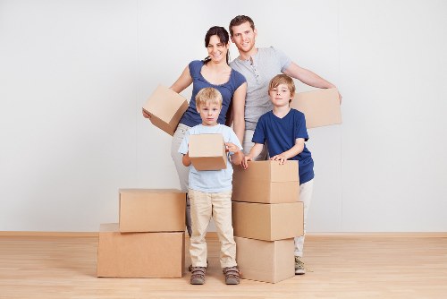 Packed boxes and furniture ready for transport in Lower Morden