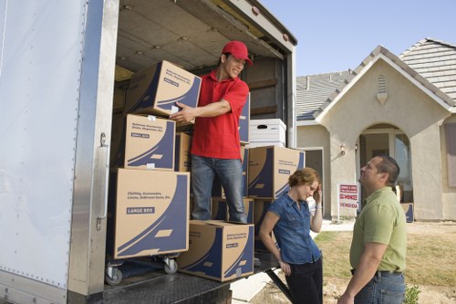 Local removal team loading boxes and household items in Lower Morden