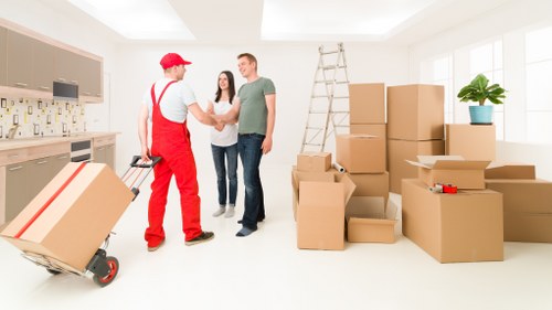 Packed office boxes and labelled materials for a local business move