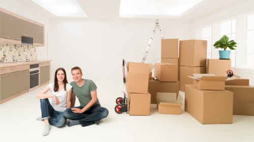 Careful loading of household items into a removals van