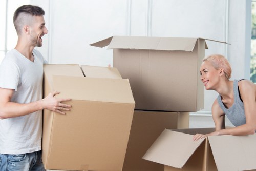 Packed boxes and furniture prepared for a Lower Morden house removal