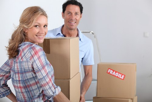 Packed boxes and furniture ready for removal van transport in Lower Morden