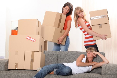 House movers handling furniture and boxes for a local Lower Morden relocation